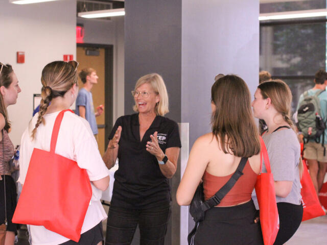 STEP Mentor Speaks Enthusiastically with Small Group of Prospective Participants