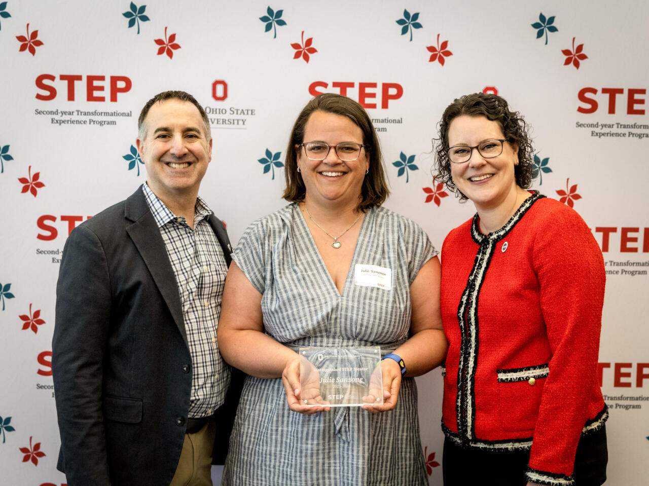 Julie Sanzone received a Distinguished Faculty Mentor Award from Rich Bruno and Julie Schultz.